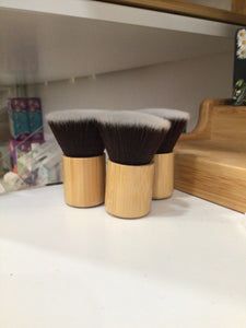 Organic dry shampoo powder travel brush.